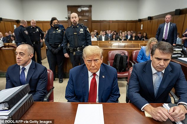 Former US President Donald Trump (center), seated with lawyers Emil Bove (left) and Todd Blanche (right), attends his trial for allegedly covering up hush money payments linked to extramarital affairs, in the Criminal Court of Manhattan, New York City, on April 25.  , 2024