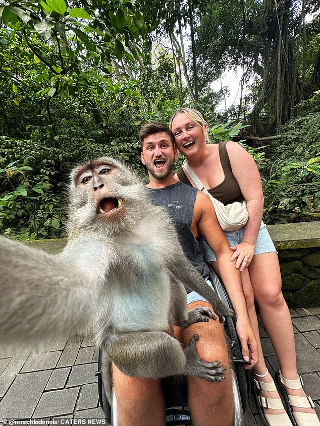 Chloe and Craig Dennis say the monkey took the photo of them while they were on vacation in Bali