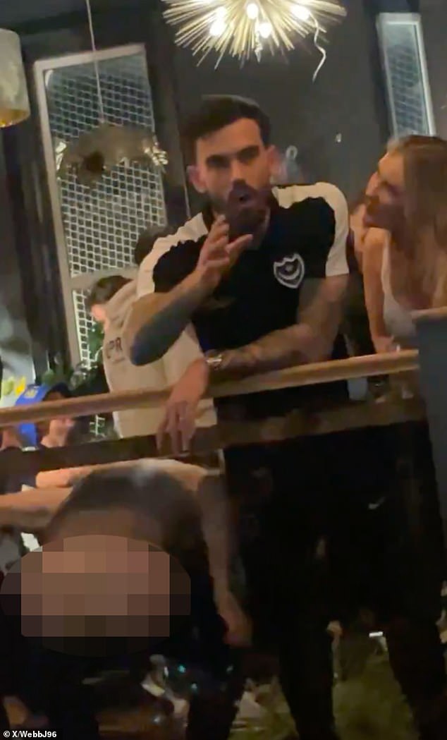 Portsmouth's wild promotion celebrations took a cheeky turn when Joe Rafferty sent fans into a frenzy while captain Marlon Pack attempted to give a speech to jubilant fans in the pub.