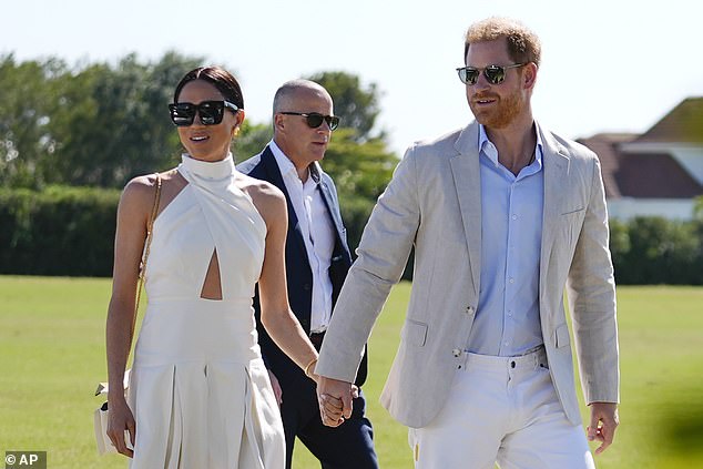 Prince Harry, right, and his wife Meghan Markle, Duchess of Sussex, arrive at the Royal Salute Polo Challenge 2024 in Florida on Friday.
