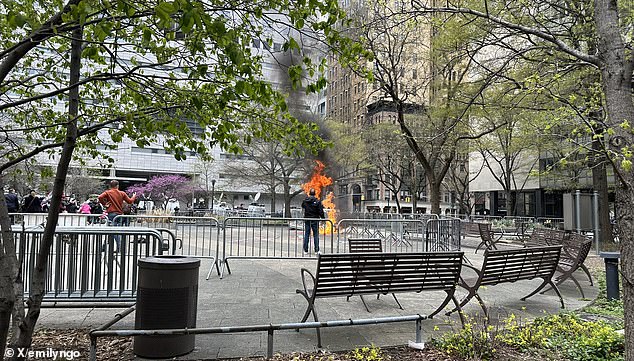 He was seen kneeling with his hands behind his head engulfed in flames as media around the world and horrified onlookers looked on.  NYPD officers rushed to extinguish the flames.