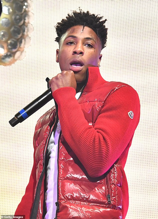 YoungBoy Never Broke Again was arrested Tuesday in Utah on weapons and drug charges, even though he was already under house arrest;  seen in 2018 in Atlanta