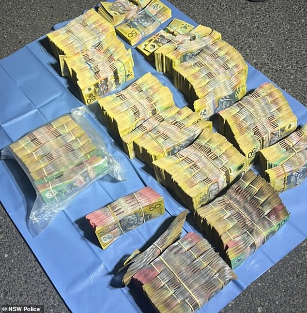 During the search, police confiscated shopping bags allegedly containing nearly a million dollars in cash.