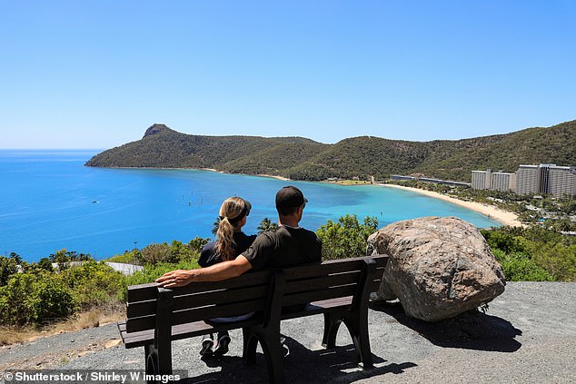 Tourists traveling to picturesque and exclusive Hamilton Island (pictured) will not be able to pay cash after operators extended Covid-era rules.