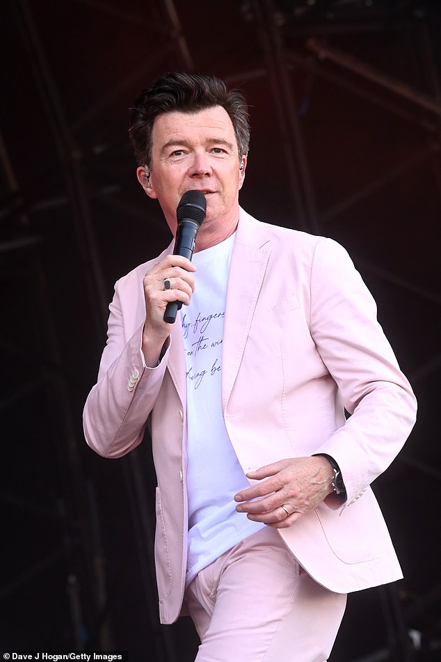Rick Astley, 58, called his '80s hit Never Gonna Give You, which catapulted him to overnight stardom, a 'shit song' (pictured on stage in 2021).