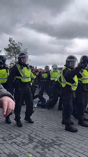 Footage shows a large group of police officers outside the Tottenham Hotspur stadium.