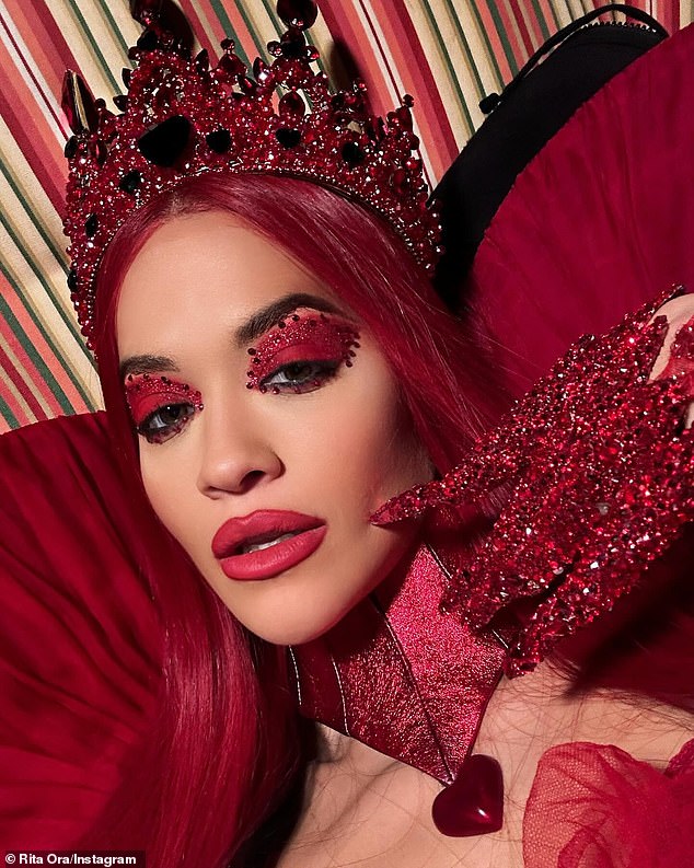 The 33-year-old singer and actress stunned in an over-the-top blood red dress as part of her role as the Queen of Hearts in the musical television movie Descendants: Rise of Red.