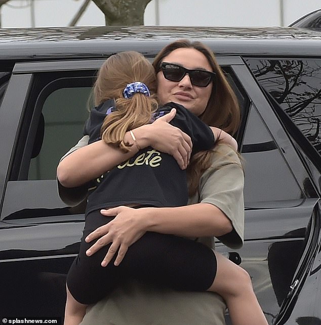 The former TOWIE star, 33, gave Paul Knightley an awkward kiss on the cheek after arriving at the airport and hugged her eldest children, Paul, seven, and Rosie, five, and said goodbye with a hug.