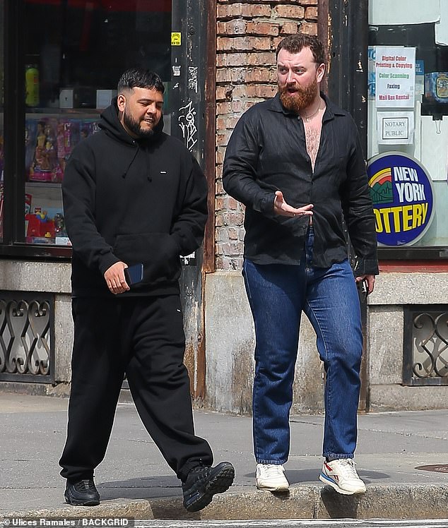 Sam Smith, 31, showed off his chest in a semi-unbuttoned shirt while out with a friend in New York City on Tuesday.