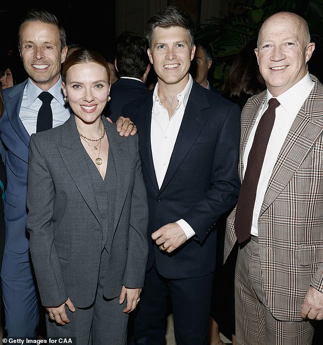 Scarlett Johansson and Colin Jost appear at the CAA Kickoff Party for the White House Correspondents' Dinner with their agent Joe Machota (left) and CAA Co-Chair Bryan Lourd (right).