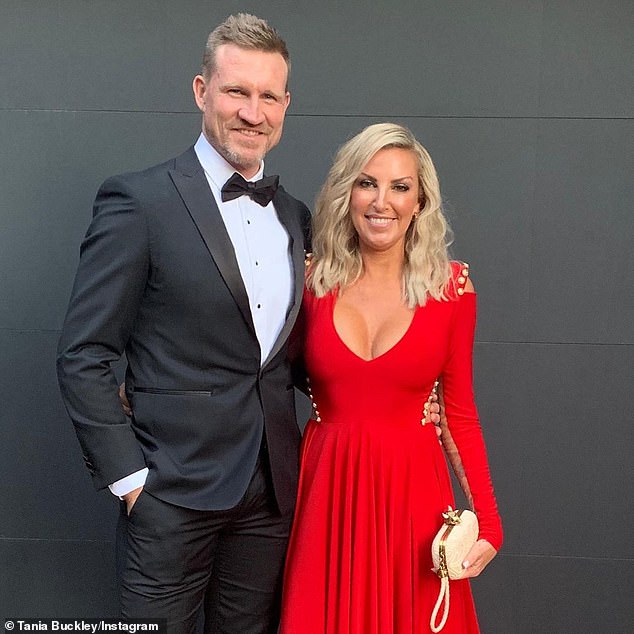 AFL legend Nathan Buckley has put some of his most prized possessions up for auction due to his 'traumatic divorce' from ex-wife Tania Minnici (pictured together)