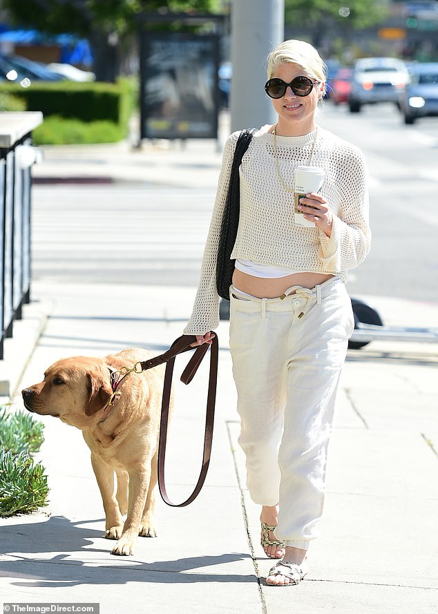 Selma Blair was seen enjoying a walk with her service dog Scout in Los Angeles on Monday.  For her outing, the actress, 51, looked effortlessly chic in a cropped cream knit sweater with bell sleeves over a white camisole.