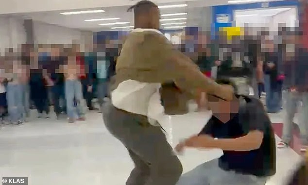 Re'Kwon Smith (left) appears in images posted on social media repeatedly punching a student (right) who is also involved in the fight.