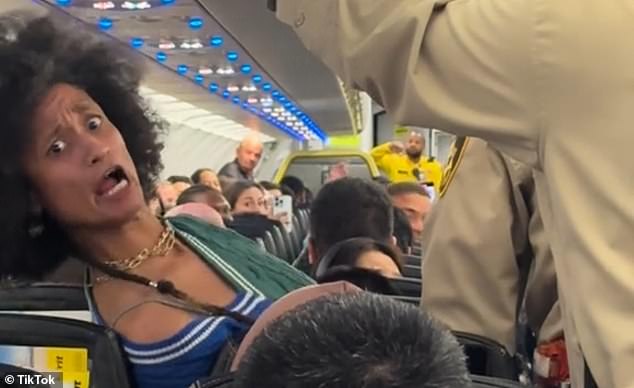 In a March 23 video that went viral online, a passenger sitting on a Spirit Airlines plane had an explosive outburst that caused those around her to film and laugh.
