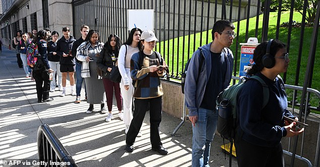 Students line up to show identification as they enter the Columbia University campus in New York City, where campus life has been disrupted by protests.