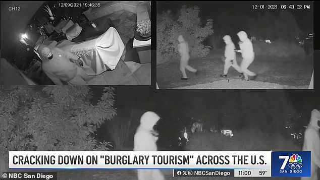 A hooded group is shown loitering around a house in an affluent San Diego suburb;  Authorities say they are foreigners who are in the U.S. on tourist visas.