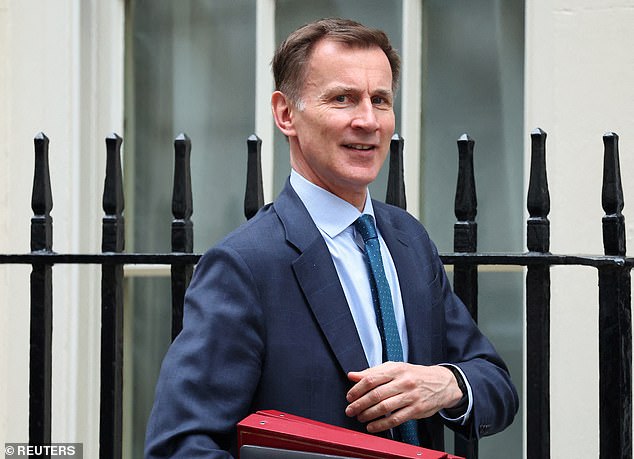 British Chancellor of the Exchequer Jeremy Hunt (pictured) leaves Downing Street on March 19
