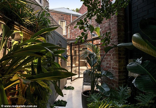 A stunning inner-city Melbourne pad that was once home to pop star Tina Arena is set to go up for auction.  Located just 3km from the CBD, the two-storey, three-bedroom, two-bathroom terrace has been listed with a price guide of $2.95 million to $3.2 million.  (In the photo)