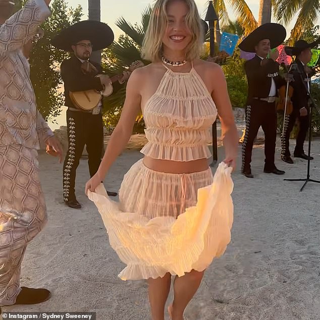 Sydney took to social media to share a collection of images from her getaway, including a clip of her dancing on the beach in a ruffled cream ensemble.