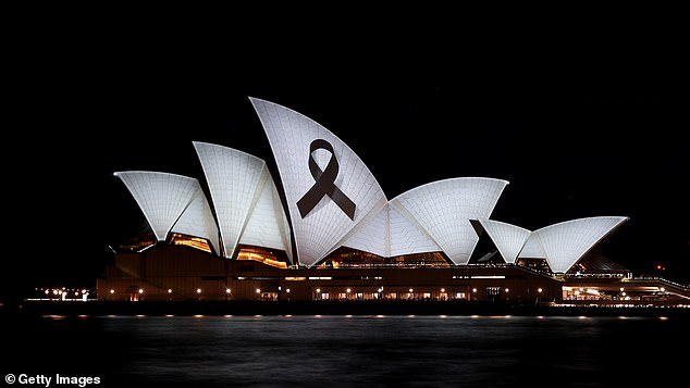 A black tape was projected at the Sydney Opera House on Monday night, two days after six people died during the deadly Bondi Junction massacre (pictured).