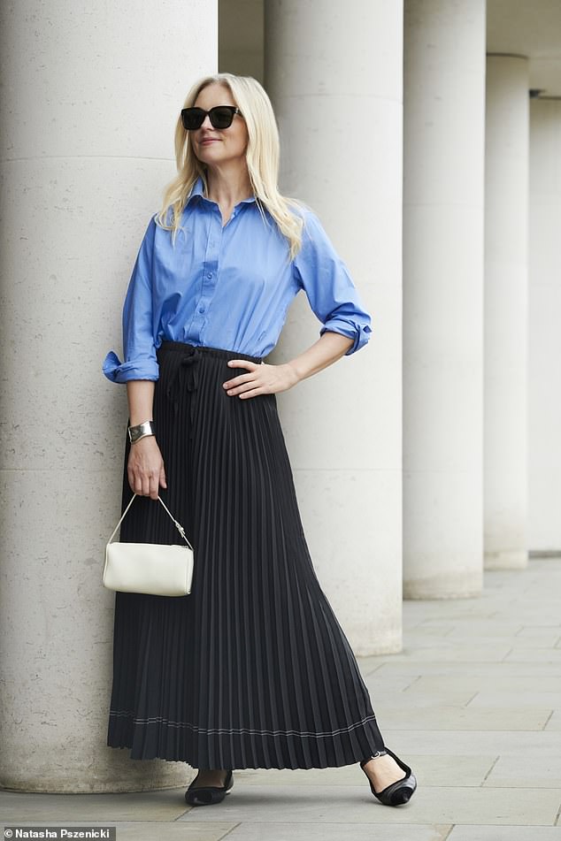 Joanne Hegarty wears a shirt (Arket);  skirt (Massimo Dutti);  bag, (The Row) and shoes (Chanel)