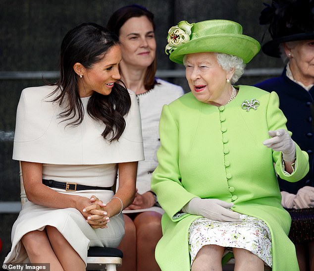 Samantha Cohen sits behind the late Queen and Duchess of Sussex on a visit to Widnes, Cheshire, in June 2018.