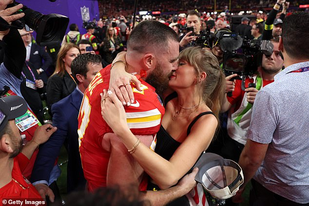 Taylor Swift and Travis Kelce brought their PDA to the Neon Carnival event in Indio, California on Saturday night;  seen in february