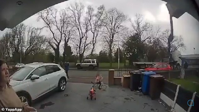 Doorbell footage shows the girl on her tricycle in her family's front yard.