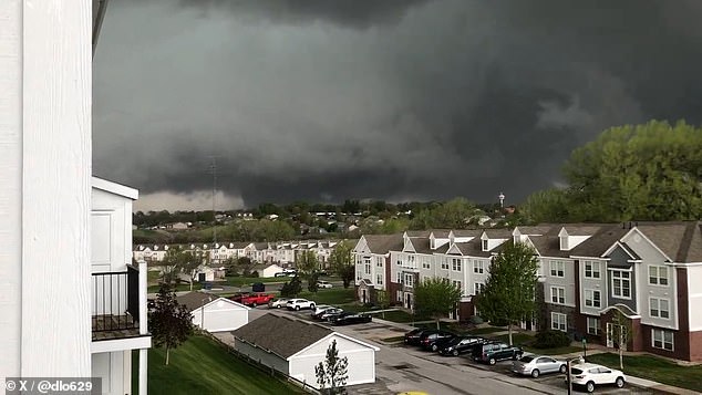 Terrifying footage was filmed of a massive tornado touching down in Nebraska on Friday.