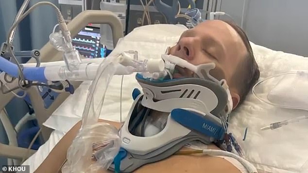 Jared Hill, pictured in hospital, was left paralyzed after being hit by a wave while surfing while on holiday in Tulum, Mexico, in February.
