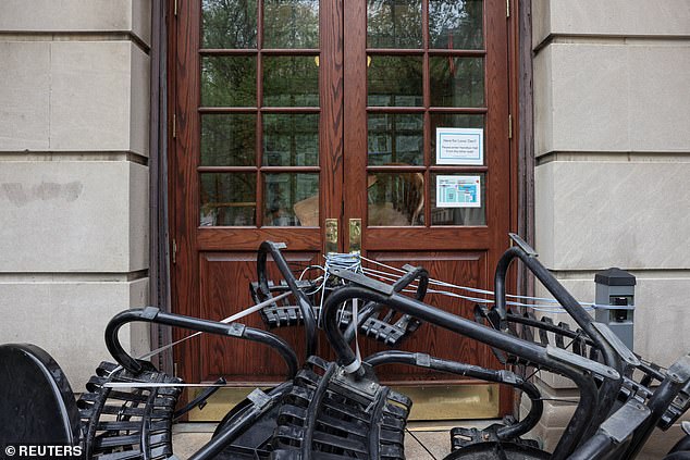 Outdoor furniture and ropes secure the main entrance to Hamilton Hall, which student protesters blocked