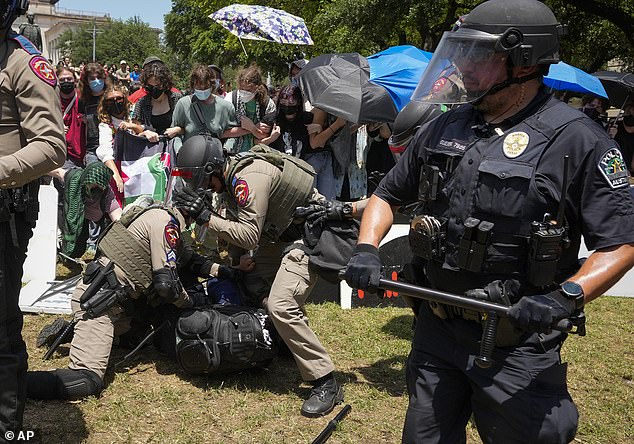 Law enforcement moved to the encampment on the university's south lawn before implementing measures to disperse those who had gathered Monday.