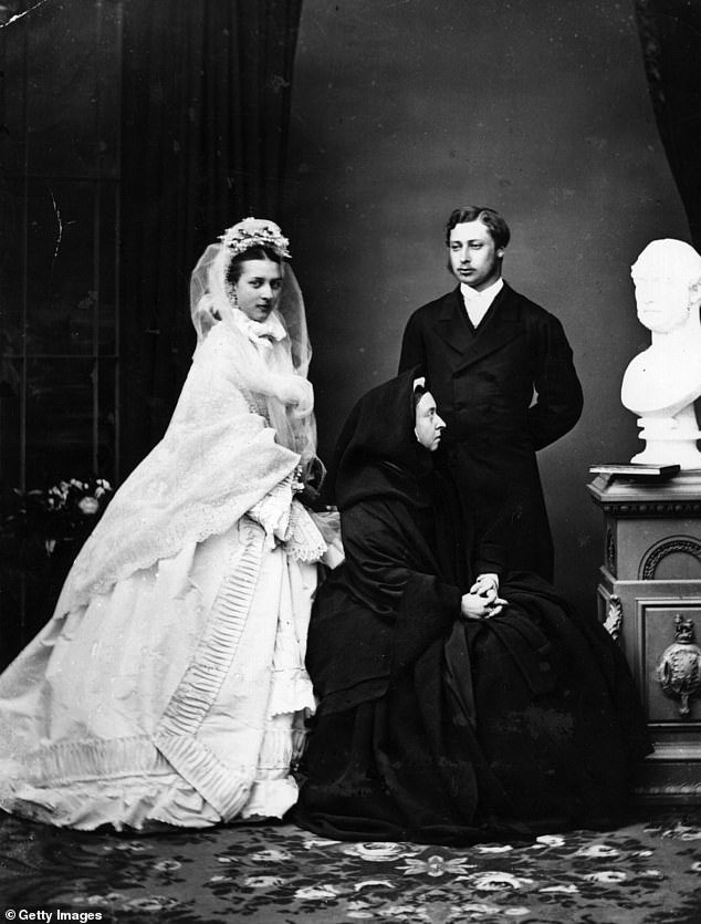 The Prince of Wales and his bride, Princess Alexandra of Denmark, just after their wedding, posing with Queen Victoria.