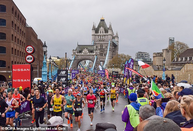 Thousands of runners cross Tower Bridge during the 2023 edition of the London Marathon