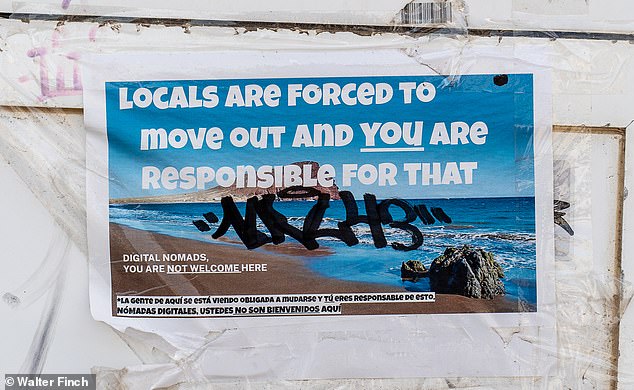 Leaflets like this one criticizing tourists are plastered on buildings all over Tenerife