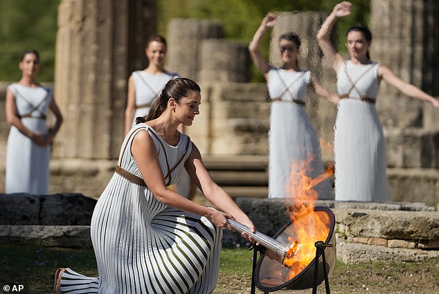 The Olympic torch is lit in a spectacular ceremony at