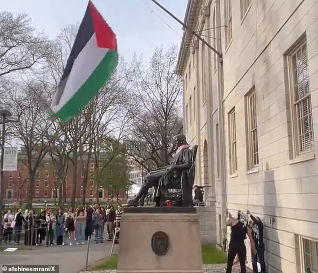 On Saturday night, a group of pro-Palestinian protesters, dressed in keffiyeh, raised a large Palestinian flag over the founder's monument.