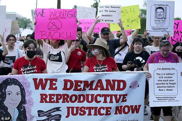 The Arizona Supreme Court ruled Tuesday that the state can enforce its long-dormant law that criminalizes all abortions except when the mother's life is at stake. Pictured: Thousands protest at the Arizona State Capitol after the Supreme Court's 2022 ruling that overturned Roe v. Wade.