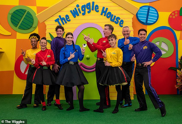 The 33-year-old, who has been dubbed the 'Hot Purple Wiggle' by thirsty mums on social media, told Yahoo Lifestyle on Wednesday that separating his work persona from his real self was a challenge. Pictured with his fellow Wiggles