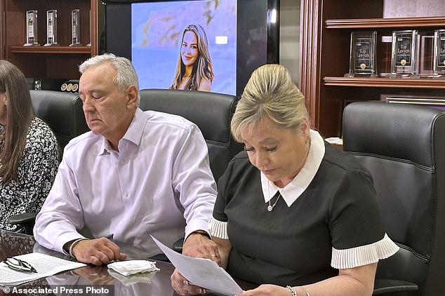 Paul and Julie Page speak to reporters in Las Vegas on Monday, April 15, 2024, as a photo of their daughter Ashley Prince is projected behind them on a screen.