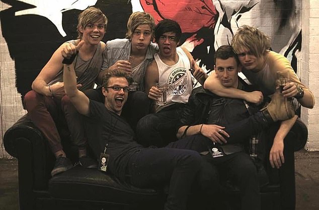 The man behind the band: Australian boy band 5 Seconds Of Summer know they owe their stardom to Adam Wilkinson (pictured, second from right) after a chance meeting in 2011.