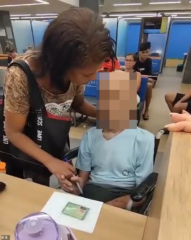 The bank employees began filming the couple and ended up calling an ambulance and the police, while Érika de Souza used her hand to hold Paulo Braga's head up and said: 'Man, are you listening? You have to sign it. I can't sign for you'