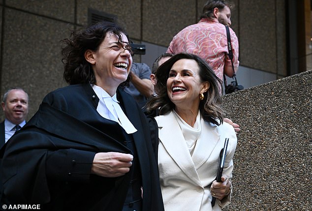 Ms Wilkinson looked elated as she left the court with her high-powered legal team.