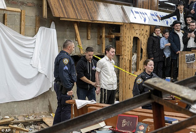 Thirteen young Orthodox Jews were arraigned Wednesday and pleaded not guilty to charges related to the bizarre January incident at a Brooklyn synagogue involving an illegally dug tunnel.