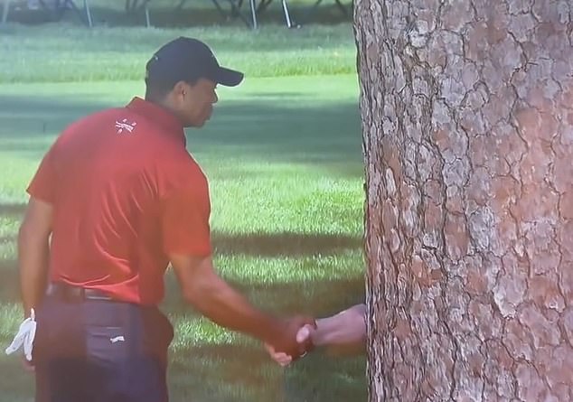 Tiger Woods interrupted his tough final round to share a moment with a mystery individual