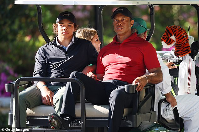 Tiger and his son Charlie Woods leave the practice area in a cart during the final round.