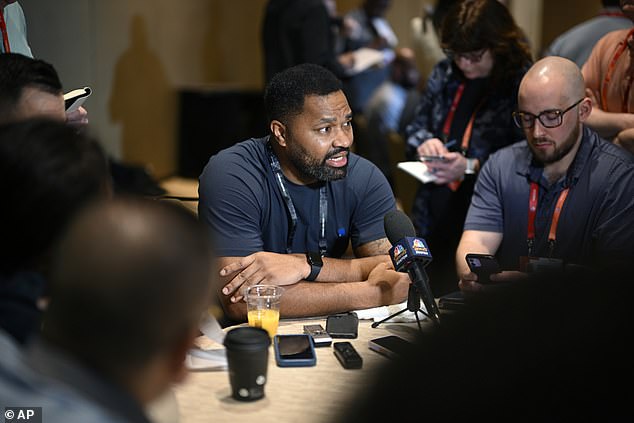 New England Patriots head coach Jerod Mayo, center, speaks to reporters in March 2024
