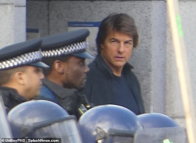 Tom Cruise, 61, was seen fighting off a riot in London's Trafalgar Square on Sunday while filming Mission Impossible: 8 sequel
