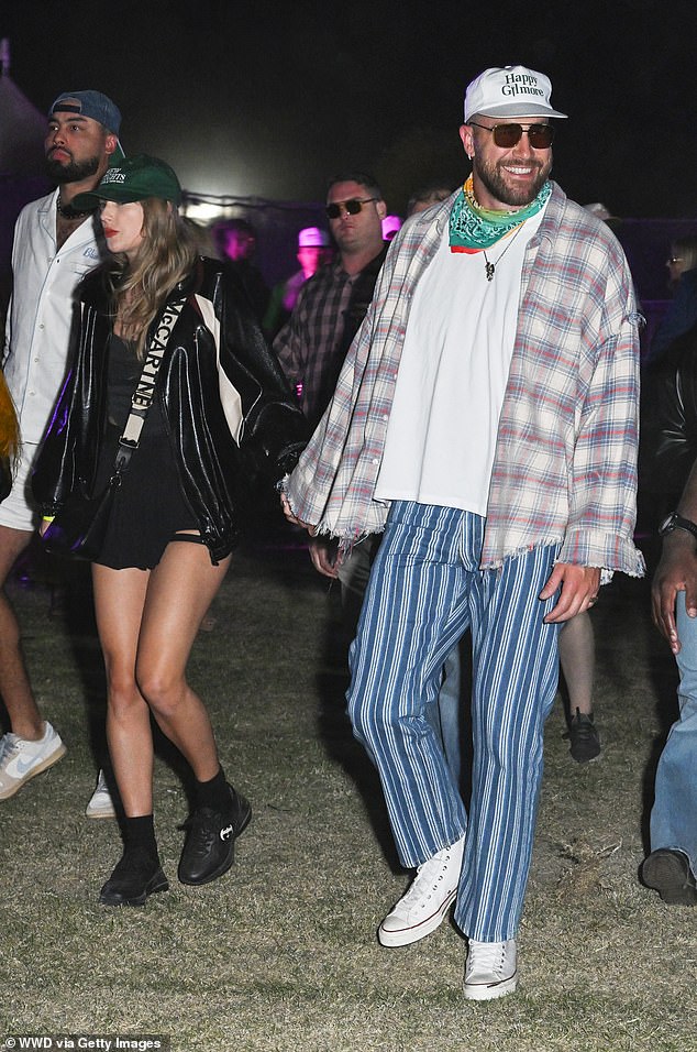 Taylor Swift and Travis Kelce are seen at Coachella earlier this month in Thermal, California.