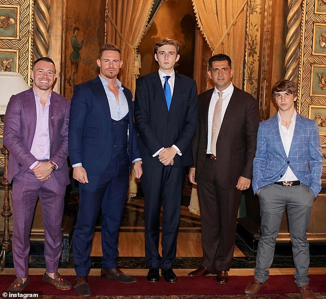 Barron Trump is his father's lookalike in new image that shows off his 6'7" towering teenager over guests (LR) Colby Covington, Justin Waller, Patrick Bet-David and Bo Loudon